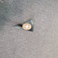 This is a top down view of the pick showing the shape of the head of the pick. It also shows the magnet's placement in the end of the handle