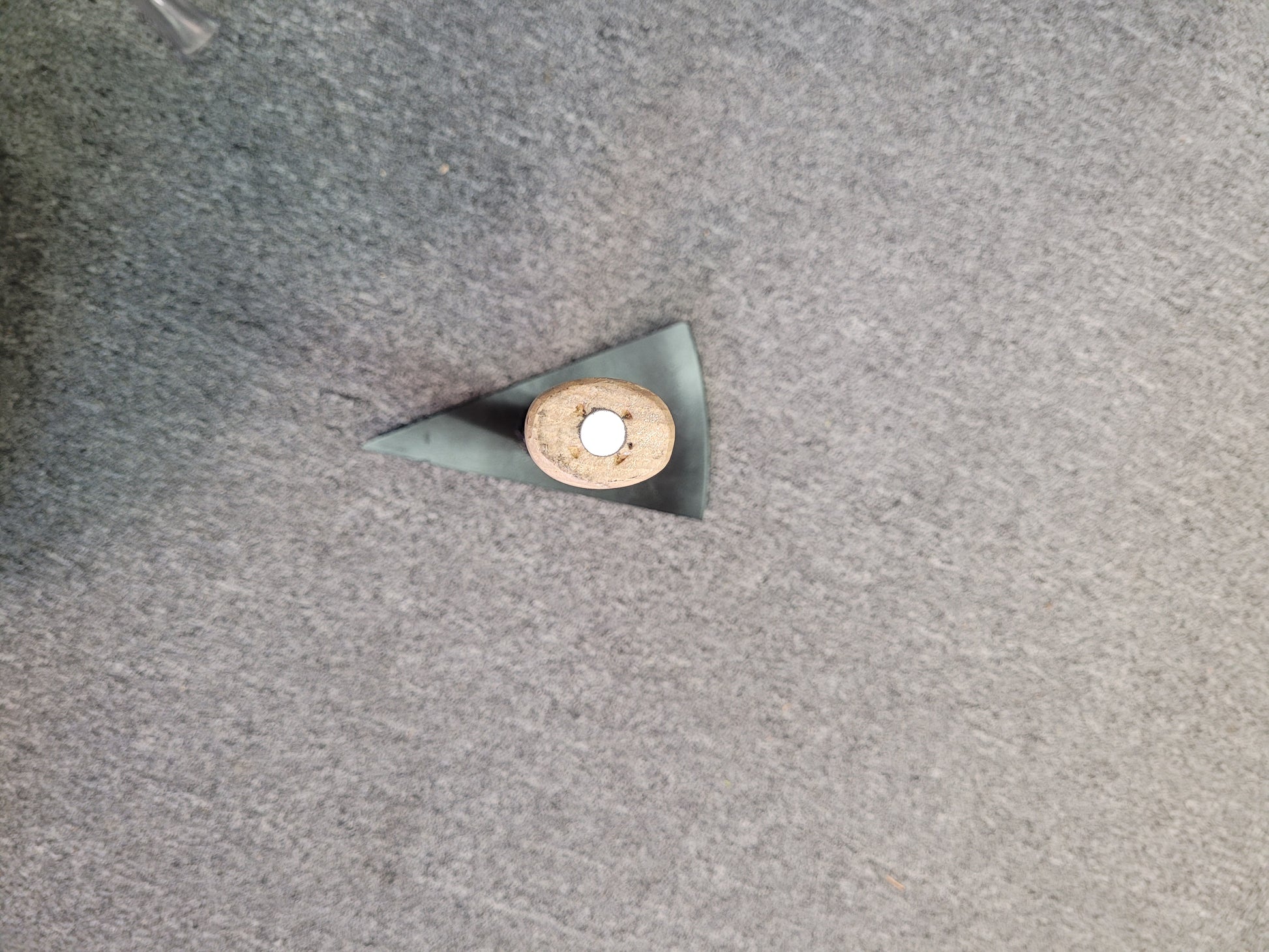 This is a top down view of the pick showing the shape of the head of the pick. It also shows the magnet's placement in the end of the handle